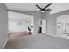 Bright bedroom with hardwood and carpeted floors, built-in desk, and ceiling fan at 1712 Shadow Bay Ct, North Las Vegas, NV 89032