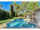 Relaxing kidney-shaped pool and spa, surrounded by a grassy backyard at 1804 Piccolo Way, Las Vegas, NV 89146