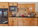 Kitchen with wood cabinets, granite countertops, and gas cooktop at 2009 Cedar Hills St, Las Vegas, NV 89128