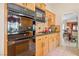 Modern kitchen with wood cabinets, granite countertops and stainless steel appliances at 2009 Cedar Hills St, Las Vegas, NV 89128