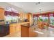 Spacious kitchen with island, wood cabinets, granite countertops, and stainless steel appliances at 2009 Cedar Hills St, Las Vegas, NV 89128