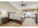 Main bedroom with a large bed, ceiling fan, and bay window at 2009 Cedar Hills St, Las Vegas, NV 89128