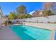 Sparkling blue rectangular pool in backyard setting at 2009 Cedar Hills St, Las Vegas, NV 89128