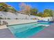 Inviting rectangular pool with surrounding patio at 2009 Cedar Hills St, Las Vegas, NV 89128