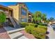 Well-maintained building exterior with landscaping at 2300 E Silverado Ranch Blvd # 2111, Las Vegas, NV 89183