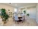 Modern dining area with a round table and six chairs at 2483 Padulle Pl, Henderson, NV 89044