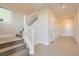 Bright entryway with carpeted stairs and neutral tile flooring at 4177 Solace St, Las Vegas, NV 89135