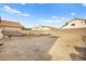 Large backyard with block wall and small table at 4414 Scarlet Sea Ave, North Las Vegas, NV 89031