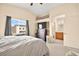 Main bedroom with large window, carpet, and ensuite bathroom at 4414 Scarlet Sea Ave, North Las Vegas, NV 89031