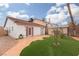 Backyard view showing patio, shed, and artificial turf at 6724 Reggie Cir, Las Vegas, NV 89107