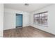 Bedroom with mirrored closet doors and wood-look flooring at 6724 Reggie Cir, Las Vegas, NV 89107