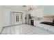 Bright kitchen with stainless steel appliances and tiled floor at 6724 Reggie Cir, Las Vegas, NV 89107