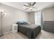 Bright bedroom with a double bed, dresser, and ceiling fan at 70 Pikiariki Ct, Las Vegas, NV 89183