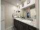 Double vanity bathroom with granite countertop at 7156 Woodrow Ranch St, Las Vegas, NV 89166