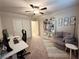 Bedroom with desk, chair, and built-in shelving at 7156 Woodrow Ranch St, Las Vegas, NV 89166