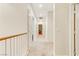 Upstairs hallway with carpet, neutral walls, and multiple doors at 8017 Flambeau St, Las Vegas, NV 89131