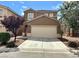 Two-story house with attached garage and landscaping at 9171 Sheffield Garden Ave, Las Vegas, NV 89148