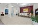 Modern dining room with white chairs and a burgundy feature wall at 10010 Savannah Marie Ave, Las Vegas, NV 89149