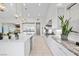 Modern kitchen with granite countertops and white cabinets at 10010 Savannah Marie Ave, Las Vegas, NV 89149