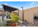 Outdoor shower with raised garden beds and pergola in background at 10010 Savannah Marie Ave, Las Vegas, NV 89149