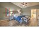 Main bedroom with ensuite bathroom and wood floors at 1052 Hollyhock Dr, Henderson, NV 89011