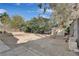 Large backyard with gravel, shed, and mature plants at 1225 S 15Th St, Las Vegas, NV 89104