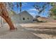 Spacious backyard with gravel ground cover and mature trees at 1225 S 15Th St, Las Vegas, NV 89104