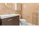 Clean bathroom with dark vanity and toilet at 1890 Golden Horizon Dr, Las Vegas, NV 89123