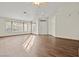 Spacious living room with wood-look floors and ceiling fan at 1890 Golden Horizon Dr, Las Vegas, NV 89123