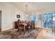 Bright dining room with hardwood floors, wood table and chairs, and a chandelier at 2736 Desert Crystal Dr, Las Vegas, NV 89134