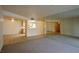 Bright living room with tile and carpet flooring, and mirrored wall at 3550 Bay Sands Dr # 2044, Laughlin, NV 89029