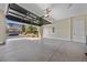 Garage with automatic door opener and view of the backyard at 64 Grey Feather Dr, Las Vegas, NV 89135