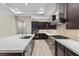 Modern kitchen with island, stainless steel appliances, and white countertops at 64 Grey Feather Dr, Las Vegas, NV 89135