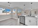 Bright kitchen features stainless steel appliances and white shaker cabinets at 6816 Rio Sands Ct, Las Vegas, NV 89130