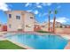 Inviting backyard with a large pool and two story home at 6816 Rio Sands Ct, Las Vegas, NV 89130