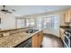 Kitchen with granite countertops and stainless steel appliances at 7232 Tealwood St, Las Vegas, NV 89131