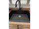 Modern kitchen sink with a matte black faucet at 7465 Desert Flame Ct, Las Vegas, NV 89149