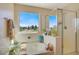 Relaxing bathroom with a large soaking tub, walk-in shower, and golf course view at 996 Via Stellato St, Henderson, NV 89011