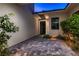 Charming courtyard entry with pavers and drought-tolerant landscaping at 10 Moonfire Dr, Las Vegas, NV 89135