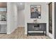 Bright hallway with contemporary console table and artwork at 10 Moonfire Dr, Las Vegas, NV 89135