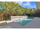 Inviting pool area with a water feature and lounge chairs at 10 Moonfire Dr, Las Vegas, NV 89135