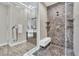 Walk-in shower with hexagonal tile and built-in seat at 10 Moonfire Dr, Las Vegas, NV 89135