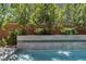 Modern water feature flows into a refreshing pool and spa at 10 Moonfire Dr, Las Vegas, NV 89135