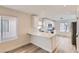 Modern kitchen with white cabinets, quartz countertops, and stainless steel appliances at 10810 Porto Foxi St, Las Vegas, NV 89141