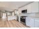 Modern kitchen with white cabinets and stainless steel appliances at 10810 Porto Foxi St, Las Vegas, NV 89141