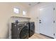 Laundry room with LG washer and dryer, and extra shelving at 10810 Porto Foxi St, Las Vegas, NV 89141