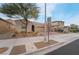 Single story house with a three-car garage and brick driveway at 1273 Olivia Pkwy, Henderson, NV 89011