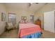 Bright bedroom featuring a comfy bed and sitting chair at 1441 Palm Dr, Laughlin, NV 89029