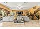 Spacious living room featuring a large sectional sofa and a flat-screen TV at 173 Kirkton St, Henderson, NV 89012