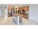 Modern kitchen with granite countertops and wood cabinets at 2191 Waterton Rivers Dr, Henderson, NV 89044